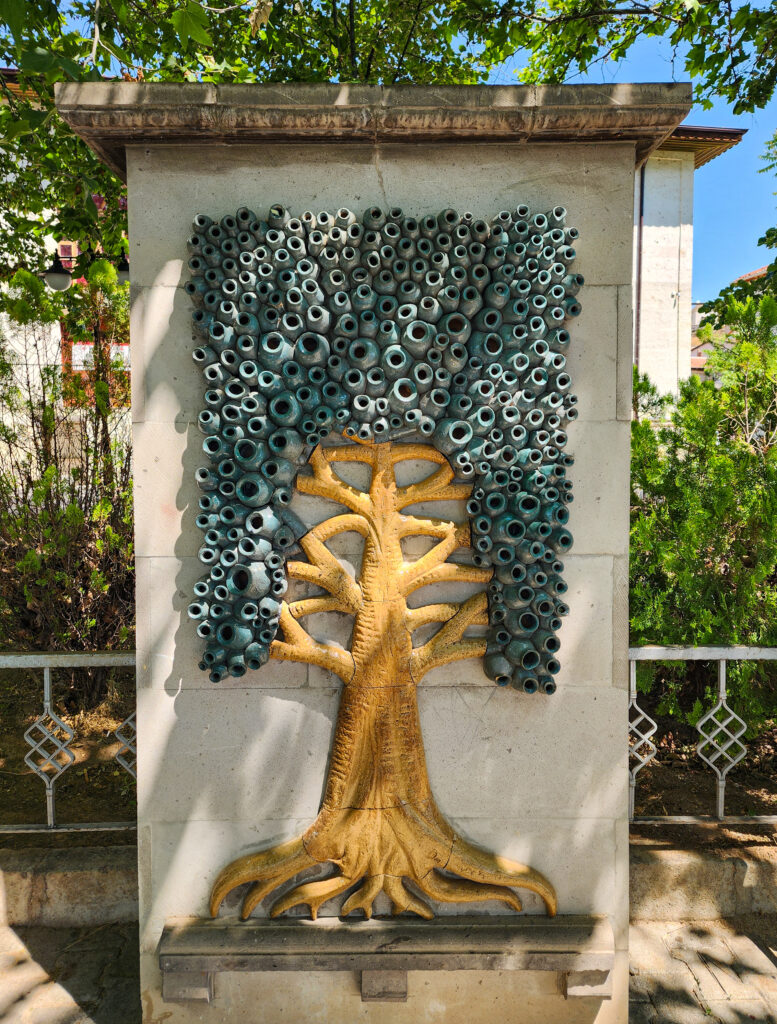 Decorative tree artwork made from blue evil eye beads in Avanos