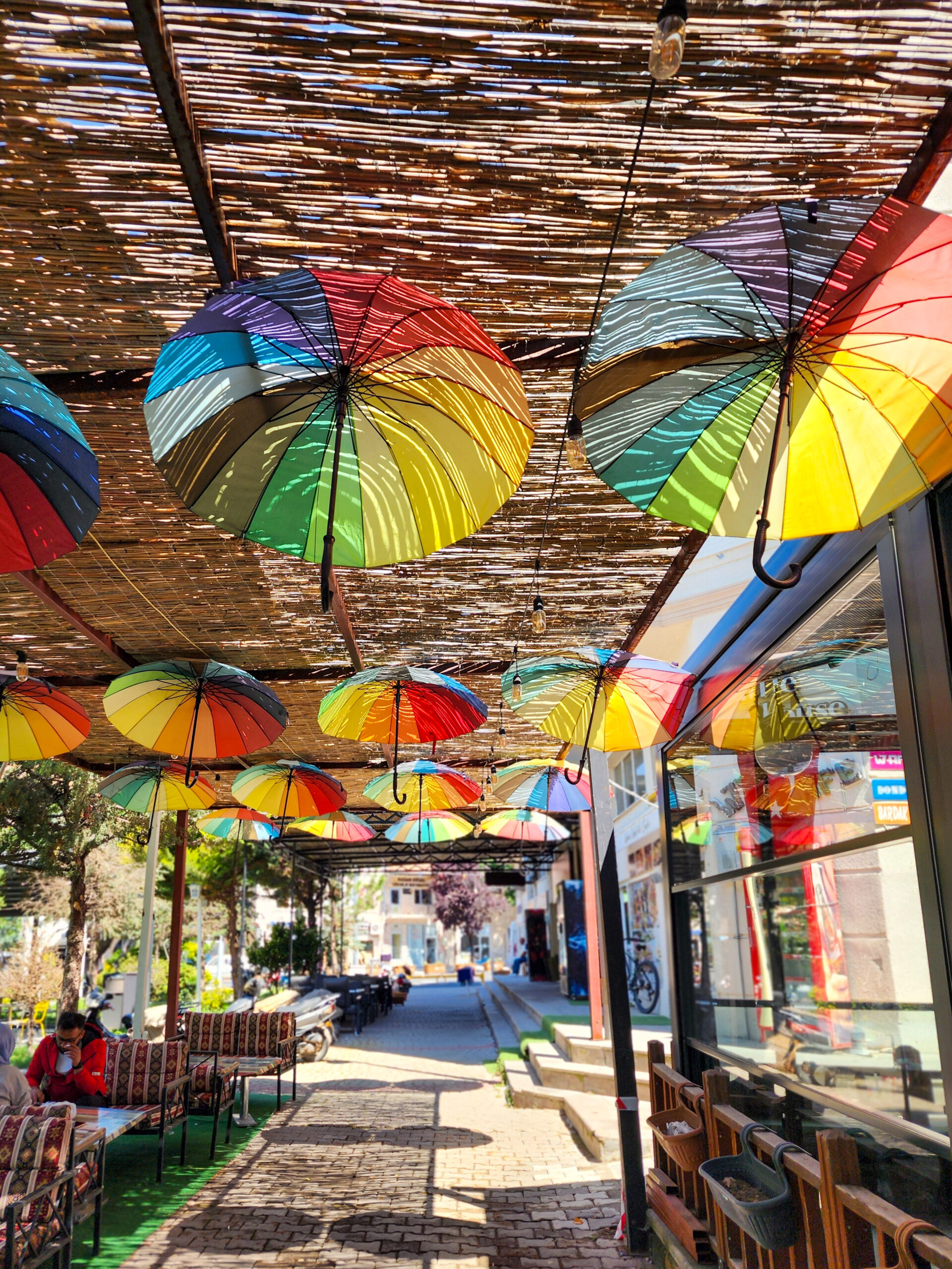 Colorful umbrellas hanging above a street in Avanos, Cappadocia