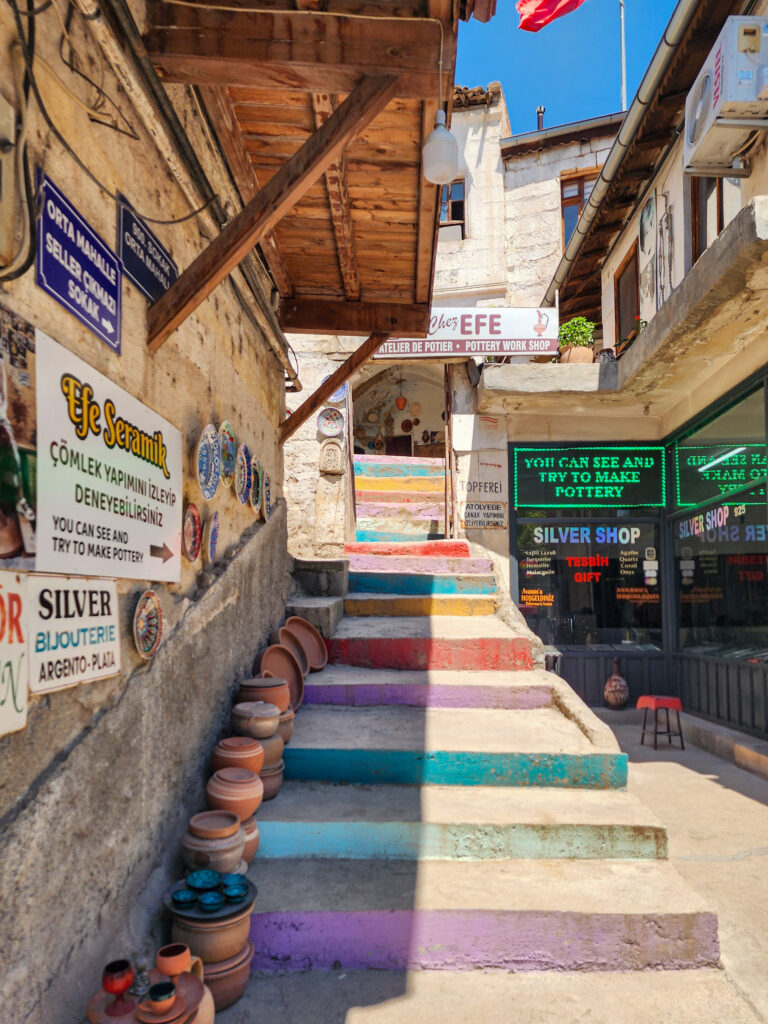 Craft workshop signs along a narrow street in Avanos Old Town