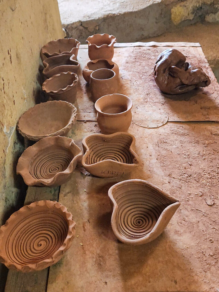 Unfinished clay pots and bowls inside an Avanos pottery workshop