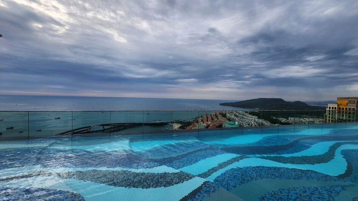 Rooftop infinity pool overlooking Kiss Bridge while living in Sunset Town Phu Quoc