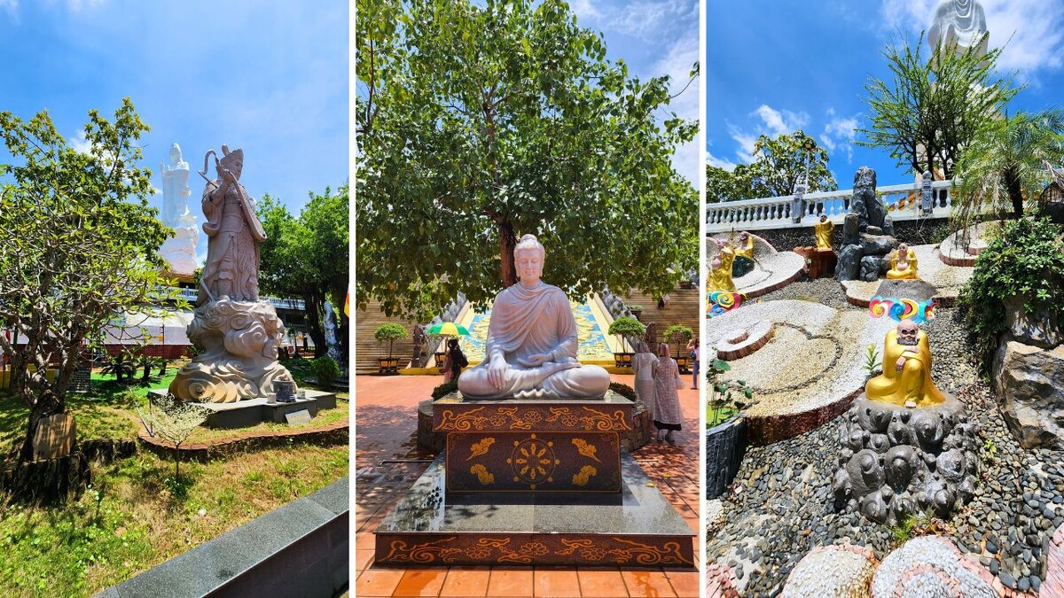 Large marble Buddha statue seated in the lotus position under a tree in the courtyard of Ho Quoc Pagoda, Phu Quoc