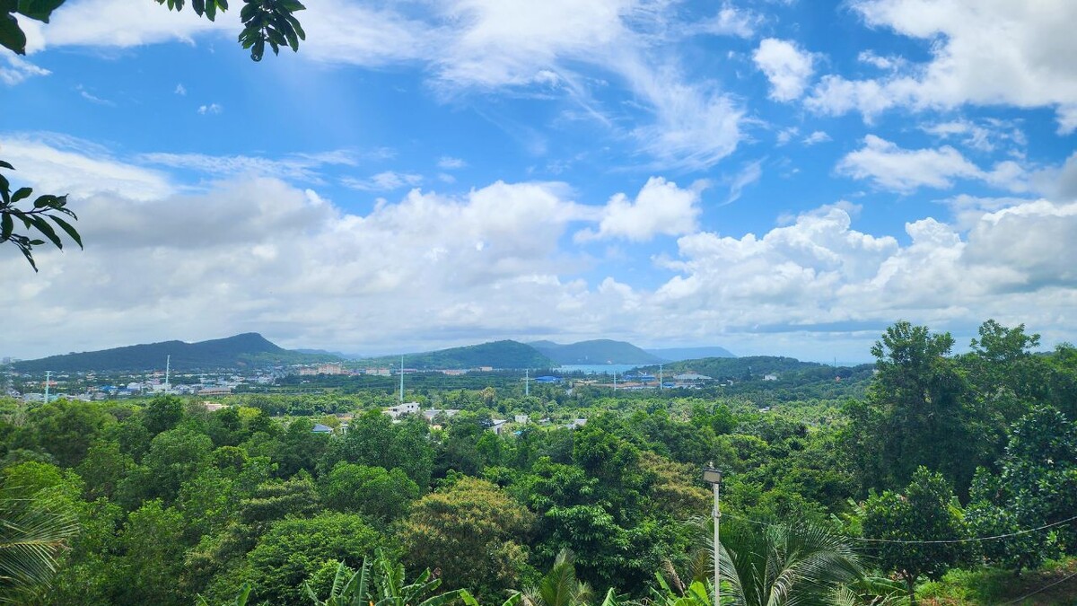 View over Phu Quoc's hills and bay from the hilltop terrace at My Happy Coffee