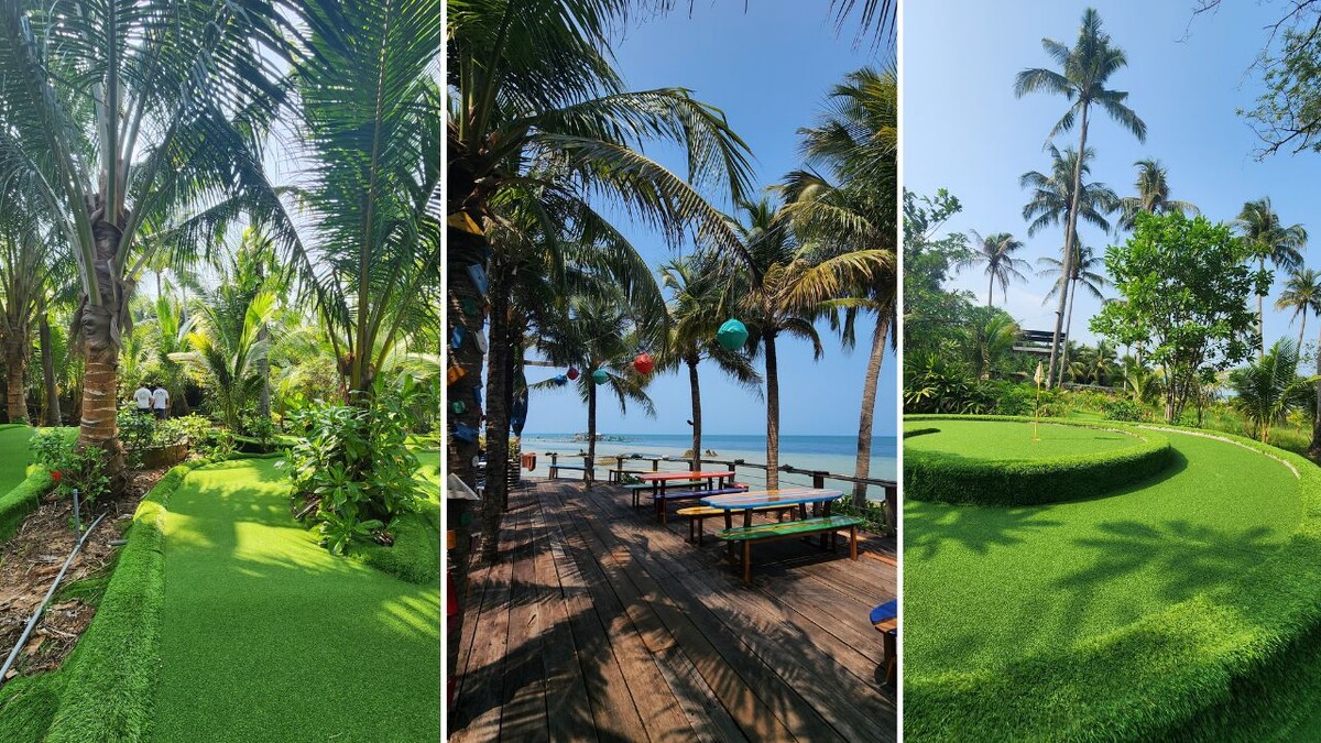 18-hole mini-golf course winding through palm trees with colorful picnic tables on a wooden deck by the sea at Rory's Beach Bar, Phu Quoc