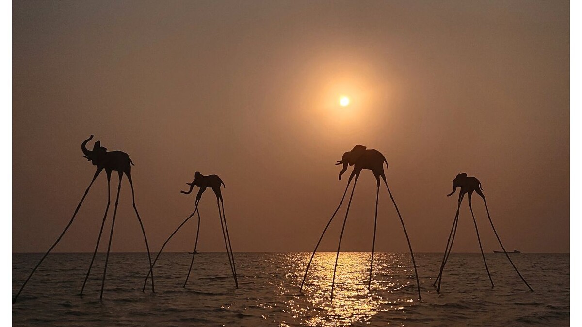 Long-legged elephant sculptures at sunset at Sunset Sanato Phu Quoc