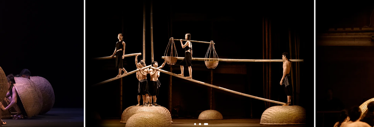 A O Show performers balancing on bamboo poles above woven basket boats
