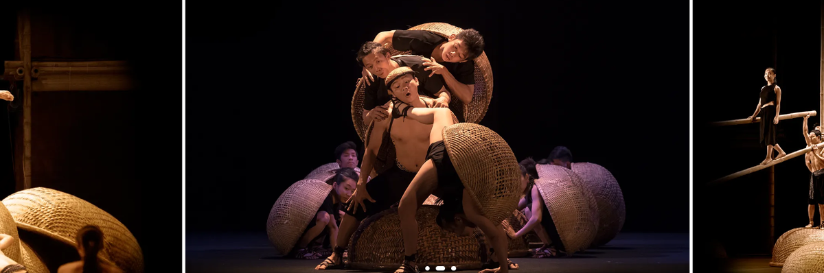 A O Show ensemble using large woven baskets during a physical theatre scene