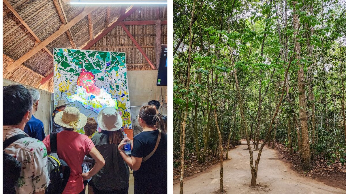 Visitors listening beside a map of Cu Chi and a shaded path through the forest