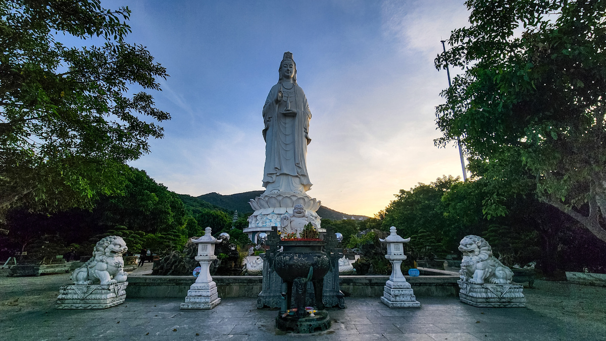 Lady Buddha statue framed by trees at Linh Ung Pagoda on Son Tra Peninsula