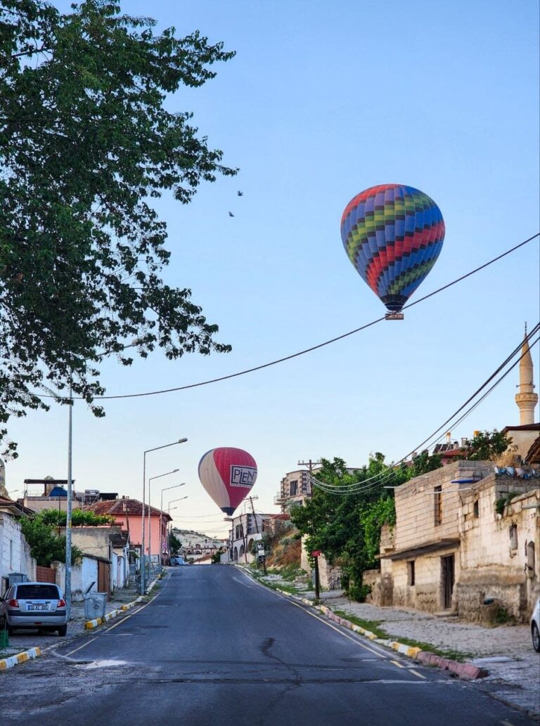 Hot air balloons above Çavuşin village in Cappadocia