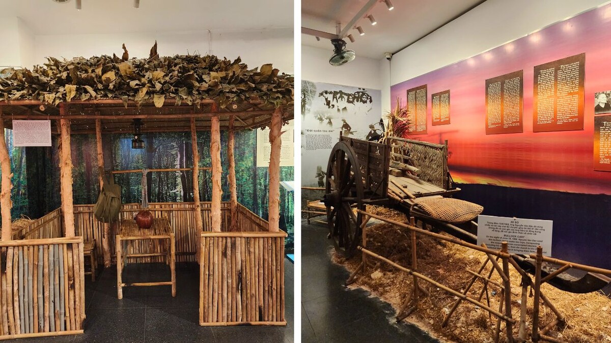 Reconstructed wartime shelter and historical display with a wooden cart inside the museum