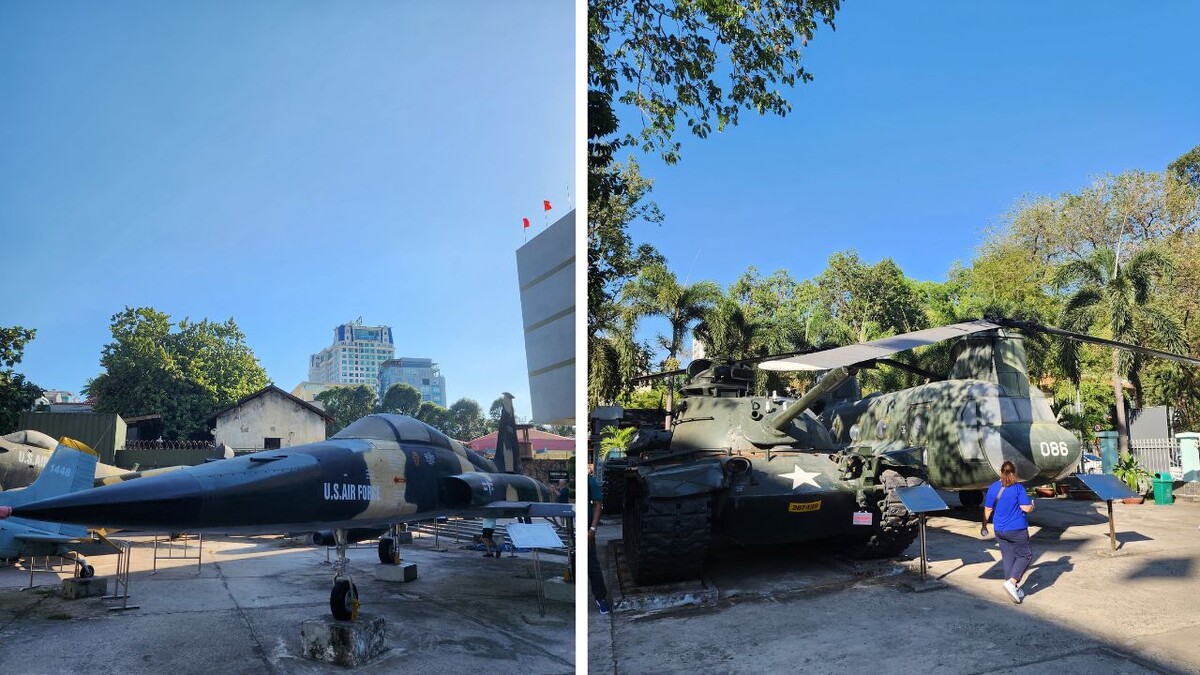 Military jet and helicopter in the museum courtyard beneath a blue sky